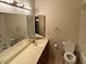 Bathroom features a tub and shower combination, toilet, and vanity at 10250 N 65Th N Ave, Glendale, AZ 85302