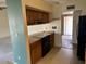 Kitchen area with wooden cabinets, black appliances and view to an open area at 10250 N 65Th N Ave, Glendale, AZ 85302