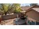 Expansive backyard view featuring desert landscaping, covered seating areas, and ample space for outdoor enjoyment at 10356 E Meandering Trail Ln, Gold Canyon, AZ 85118