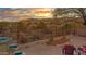 Relaxing backyard features a fire pit, comfortable seating, desert landscaping, and picturesque mountain views at 10356 E Meandering Trail Ln, Gold Canyon, AZ 85118