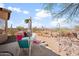 Relaxing backyard oasis with patio, seating area, desert landscaping, and views, perfect for outdoor living at 10356 E Meandering Trail Ln, Gold Canyon, AZ 85118