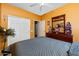 Comfortable bedroom with warm colors, a dark wood dresser, and a queen-size bed at 10356 E Meandering Trail Ln, Gold Canyon, AZ 85118