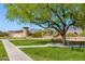 Community park with a walking path and park benches framed by a scenic view of mountains at 10356 E Meandering Trail Ln, Gold Canyon, AZ 85118