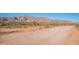 Scenic view of a dirt road with mountains and desert landscape at 10356 E Meandering Trail Ln, Gold Canyon, AZ 85118