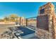 Gated entrance to Peralta Trails with desert landscaping and welcome sign at 10356 E Meandering Trail Ln, Gold Canyon, AZ 85118