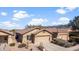 Single-Gathering home with a two-car garage, desert landscaping, and a red tile roof at 10356 E Meandering Trail Ln, Gold Canyon, AZ 85118
