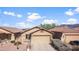 Attractive single-Gathering home featuring desert landscaping, a two-car garage, and mountain views at 10356 E Meandering Trail Ln, Gold Canyon, AZ 85118
