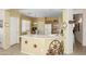 Bright eat-in kitchen featuring a breakfast bar and easy access to the dining area at 10356 E Meandering Trail Ln, Gold Canyon, AZ 85118