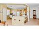 Inviting eat-in kitchen featuring a breakfast bar and easy access to the dining area at 10356 E Meandering Trail Ln, Gold Canyon, AZ 85118