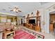 Spacious living room with tile floors, entertainment center, and comfortable seating at 10356 E Meandering Trail Ln, Gold Canyon, AZ 85118