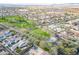 An aerial view of the neighborhood and home with easy access to the nearby greenbelt and park at 12698 N 153Rd Ave, Surprise, AZ 85379