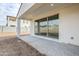 Covered back patio with recessed lighting and sliding glass doors looking out to the backyard at 12698 N 153Rd Ave, Surprise, AZ 85379