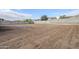 Large, unfinished backyard features block fencing for added privacy at 12698 N 153Rd Ave, Surprise, AZ 85379