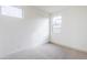 Bedroom with two windows allowing lots of natural light, carpet floors, and base molding at 12698 N 153Rd Ave, Surprise, AZ 85379