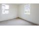 Bright bedroom with carpeted floors and a large window offering natural light and views at 12698 N 153Rd Ave, Surprise, AZ 85379