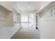 A well-organized walk-in closet with built-in shelving, carpet floors, and a view into the bathroom at 12698 N 153Rd Ave, Surprise, AZ 85379