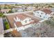 Aerial shot of a two-story home showing a red-tile roof and a large dirt-filled backyard at 12698 N 153Rd Ave, Surprise, AZ 85379