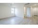 Bright hallway with tile floors leading into a bedroom and bath, perfect for guests at 12698 N 153Rd Ave, Surprise, AZ 85379