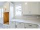 Bright kitchen featuring white cabinets, subway tile backsplash, and modern fixtures at 12698 N 153Rd Ave, Surprise, AZ 85379