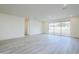 A spacious living room area with tile flooring and a sliding glass door, providing lots of natural light at 12698 N 153Rd Ave, Surprise, AZ 85379