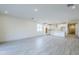 Spacious living room features tile flooring, recessed lighting, and a view of the kitchen area at 12698 N 153Rd Ave, Surprise, AZ 85379