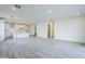 Open-concept living space with modern tile flooring connecting the living room and kitchen for easy entertaining at 12698 N 153Rd Ave, Surprise, AZ 85379