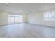 A spacious living room area with tile flooring and a sliding glass door, providing lots of natural light at 12698 N 153Rd Ave, Surprise, AZ 85379