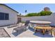 Relaxing backyard features lounge chairs and a metal stock tank pool, ideal for enjoying sunny days at 13614 N 38Th Pl, Phoenix, AZ 85032