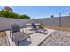 Stylish backyard featuring lounge chairs, a stock tank pool, and a decorative privacy wall at 13614 N 38Th Pl, Phoenix, AZ 85032