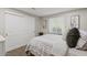 Comfortable bedroom with a large window, closet, and soft carpet flooring at 13614 N 38Th Pl, Phoenix, AZ 85032