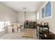 Dining area with a built-in bench, bar with a beverage cooler and game storage at 13614 N 38Th Pl, Phoenix, AZ 85032