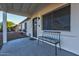 Inviting front porch with comfortable seating, a secure front door, and ample natural light at 13614 N 38Th Pl, Phoenix, AZ 85032