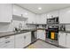 Well-equipped kitchen featuring stainless steel appliances, white cabinets, and sleek countertops at 13614 N 38Th Pl, Phoenix, AZ 85032