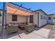Cozy covered patio with plush seating, ideal for relaxing and enjoying the outdoors in comfort at 13614 N 38Th Pl, Phoenix, AZ 85032