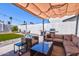 Inviting covered patio with comfortable seating and a barbecue grill, perfect for outdoor gatherings at 13614 N 38Th Pl, Phoenix, AZ 85032