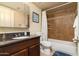 Well-lit bathroom with vanity, granite countertop, and tiled shower at 14145 N 92Nd St # 2077, Scottsdale, AZ 85260