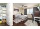 Comfortable bedroom featuring a ceiling fan, large window and an organized walk-in closet at 14145 N 92Nd St # 2077, Scottsdale, AZ 85260