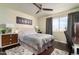 Inviting bedroom with a ceiling fan, a window with natural light, and modern furnishings at 14145 N 92Nd St # 2077, Scottsdale, AZ 85260