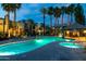 Lush community pool area with well-kept landscaping and a shaded lounge space at 14145 N 92Nd St # 2077, Scottsdale, AZ 85260