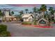 A well-maintained community entrance with lush landscaping, manicured lawns, and building exteriors at 14145 N 92Nd St # 2077, Scottsdale, AZ 85260