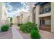 Attractive condo exterior with balconies and desert landscaping at 14145 N 92Nd St # 2077, Scottsdale, AZ 85260
