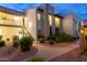 Inviting condo building exterior with well-maintained landscaping and staircase access at 14145 N 92Nd St # 2077, Scottsdale, AZ 85260