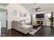 Inviting living room with a fireplace, dark wood floors, and a comfortable sectional sofa at 14145 N 92Nd St # 2077, Scottsdale, AZ 85260