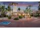 An inviting residence center featuring beautiful architecture, lush landscaping, and ample parking at 14145 N 92Nd St # 2077, Scottsdale, AZ 85260