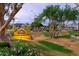 Community signage surrounded by greenery, indicating a welcoming and landscaped environment at 14145 N 92Nd St # 2077, Scottsdale, AZ 85260