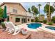 Charming backyard featuring a pool, spa, lounge chairs, and a well-manicured garden area at 1567 S Western Skies Dr, Gilbert, AZ 85296