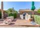 Outdoor kitchen in the backyard with a built-in grill and brick pavers at 1567 S Western Skies Dr, Gilbert, AZ 85296