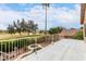 Relaxing balcony view of a lush golf course, mature trees, and a cozy in-ground spa at 1567 S Western Skies Dr, Gilbert, AZ 85296