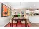 Bright dining room with a long table and artistic chairs, alongside large windows at 1567 S Western Skies Dr, Gilbert, AZ 85296