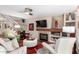 Bright living room with hardwood floors, fireplace and neutral decor creates a welcoming atmosphere at 1567 S Western Skies Dr, Gilbert, AZ 85296